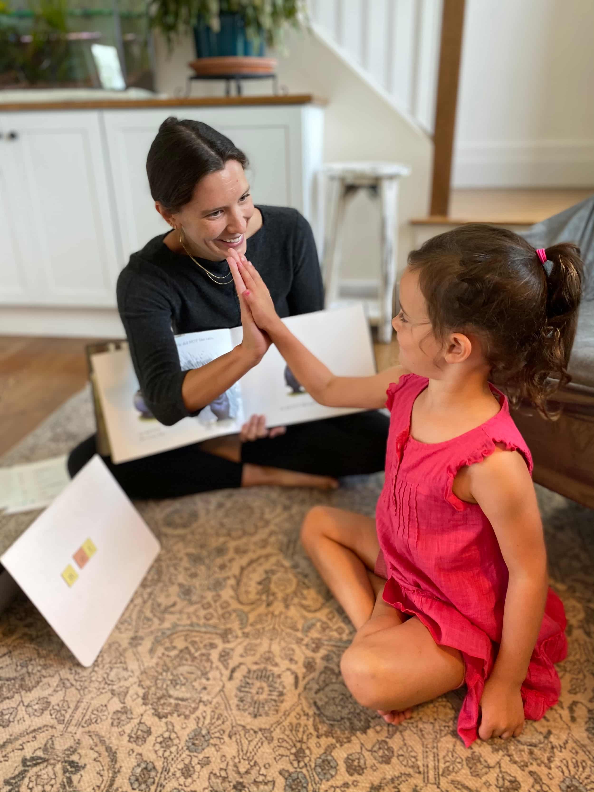 Ulana high-fiving a student during a session